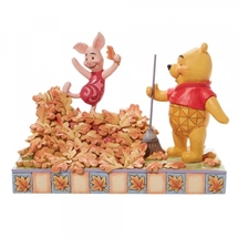 Disney Traditions - Piglet playing in a pile of leaves H: 14 cm.